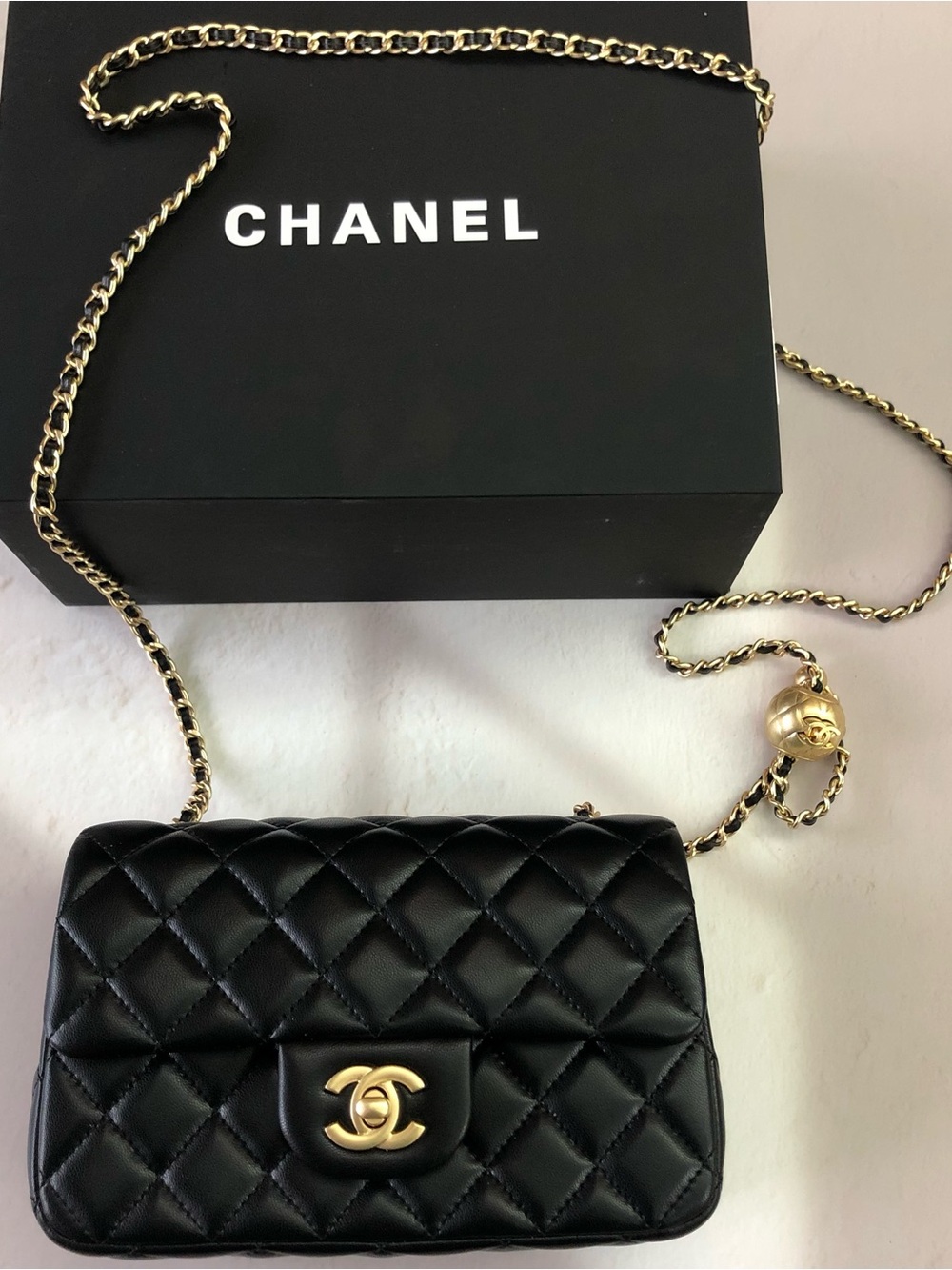 CHANEL Black Quilted Lambskin Mini Flap Bag with Gold Chain